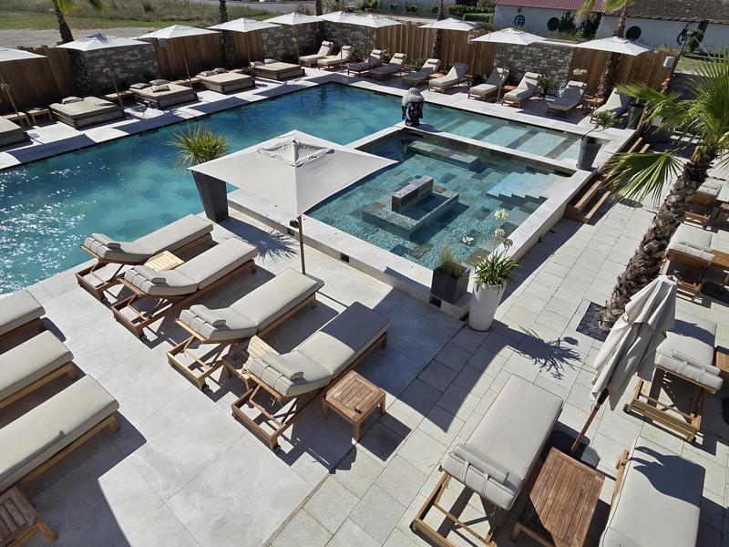 Swimming pool at Les Loges du Luberon Swimming pool and lounge area at Les Loges du Luberon facing the massif