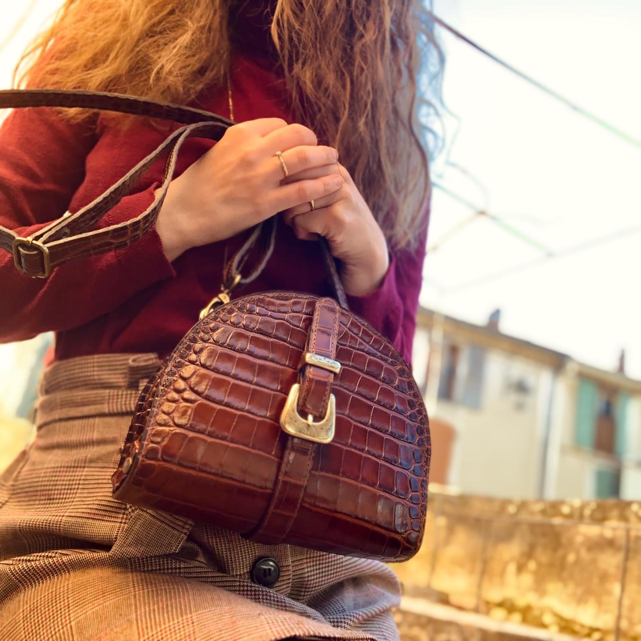 Handcrafted leather bag by Maison Rottier worn crossbody in the Luberon