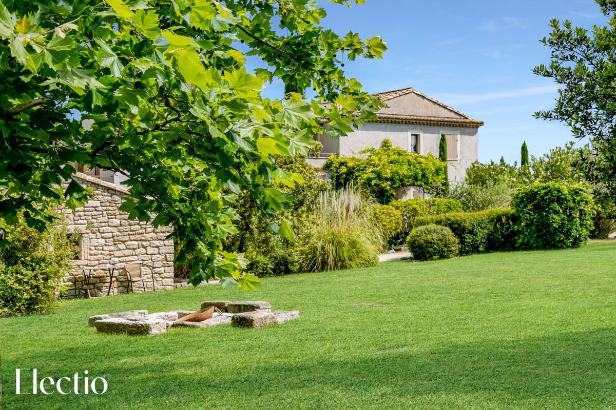 View of the landscaped garden and Les Petitons Residence in Oppède, Luberon