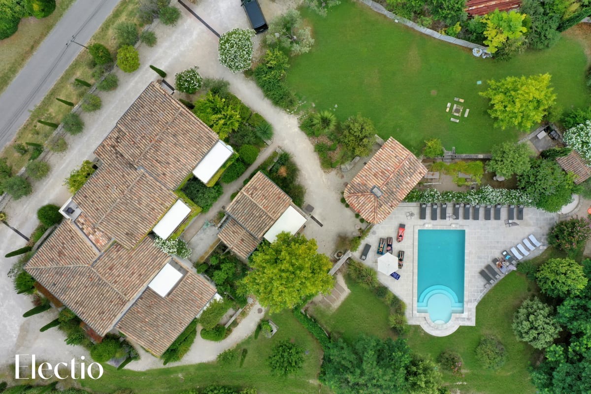 Aerial view of Résidence Les Petitons with pool and gardens