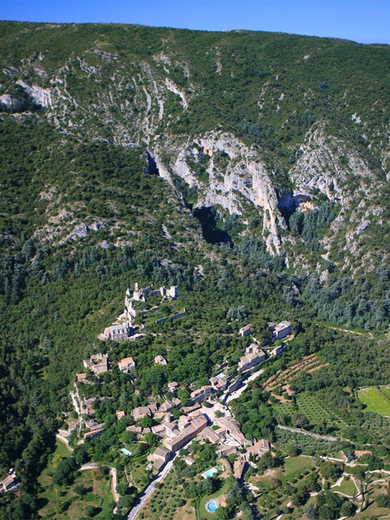 Aerial view of Oppède-le-Vieux and the ridges of the Petit Luberon