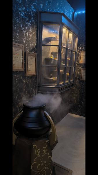Immersive room styled like a magical shop with a steaming cauldron at Last Adventures