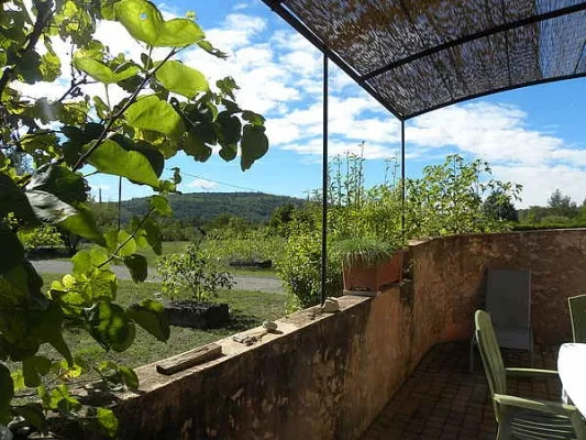 Terrace of the cabanon in Gordes with outdoor furniture and countryside views
