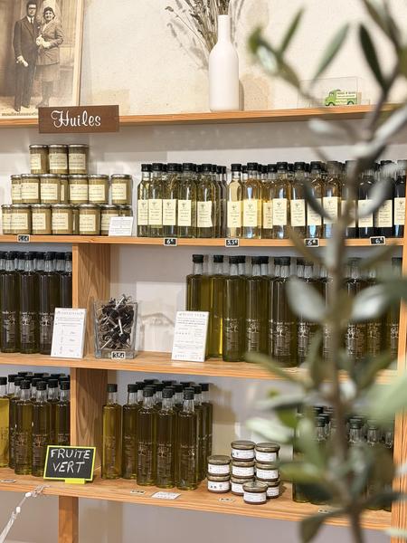 Display of artisanal olive oil bottles and tasting in an olive mill in the Luberon