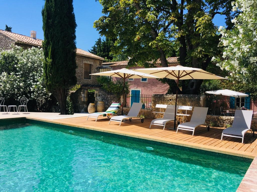 Heated swimming pool at Le Mas de la Sorgue in Le Thor, peaceful guest house with landscaped garden in Provence
