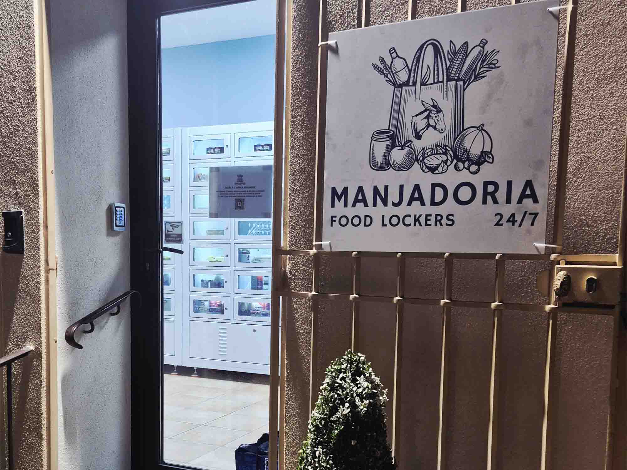 Entrance of Manjadoria with 24/7 food lockers sign and self-service food lockers inside