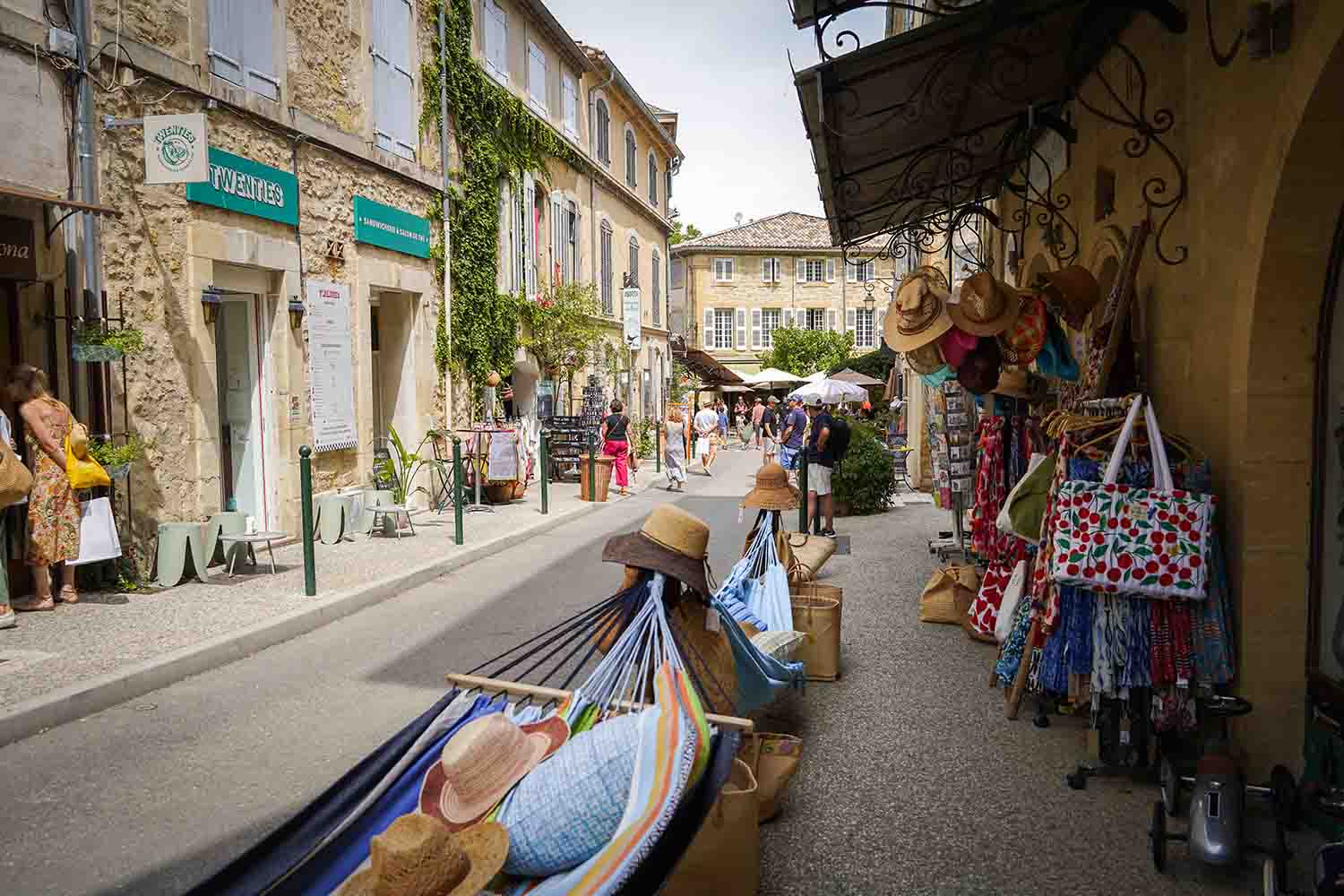Lively street in Lourmarin with shops and village atmosphere