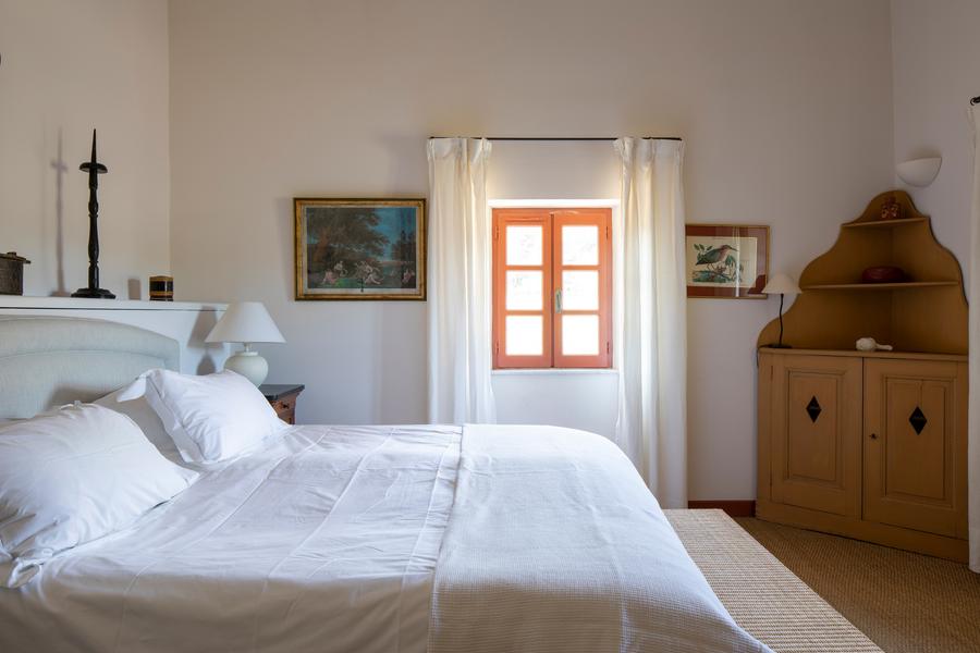 Bright bedroom at Mas Petit Collongue with double bed and Provençal decor