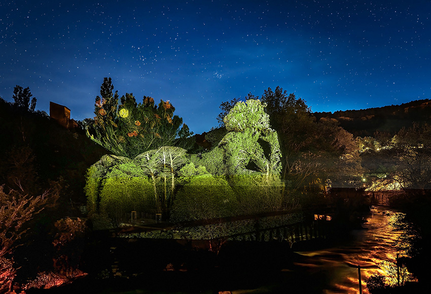 Light projection on the vegetation during the Fontaine-de-Vaucluse, Source of Legends show