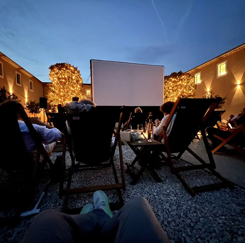 Open-air cinema evening at Mas des Infermières Open-air cinema screen set up at Mas des Infermières in Oppède