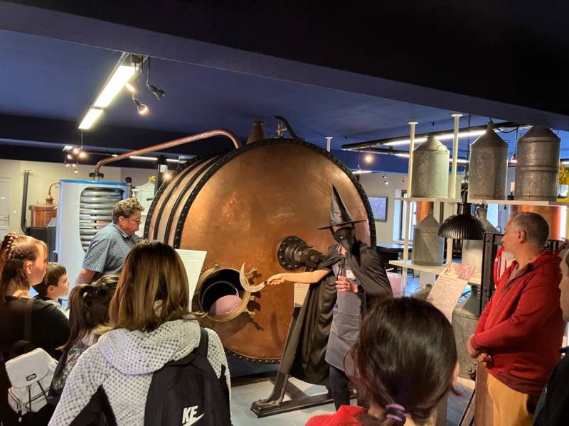 Guided tour beside an old still at the Luberon Lavender Museum