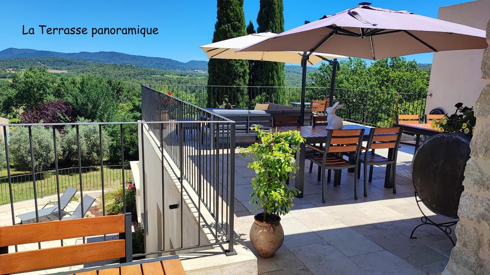 Panoramic terrace with outdoor furniture and views of the Luberon