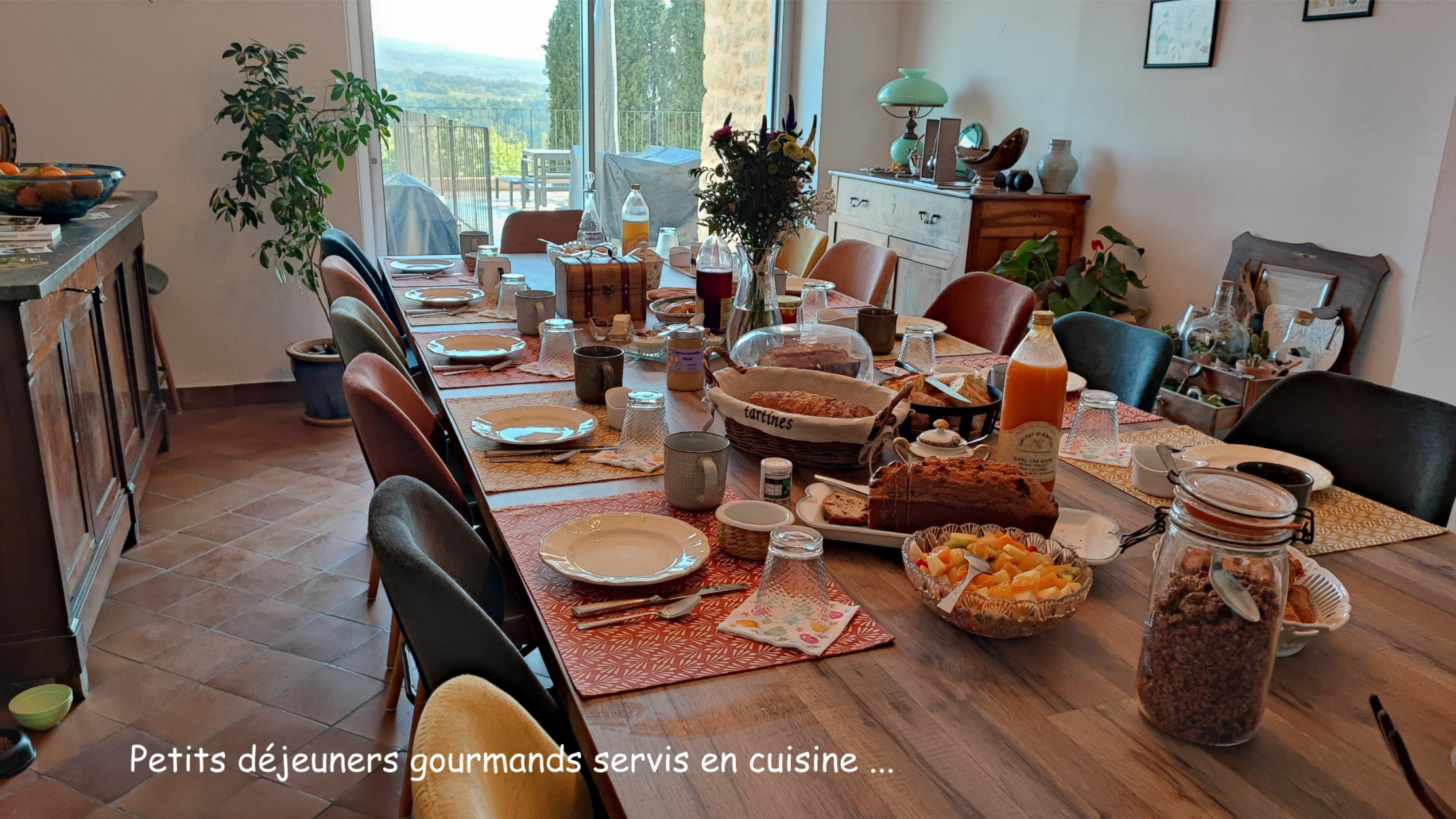 Breakfast table with drinks, bread and a selection of delicious breakfast treats