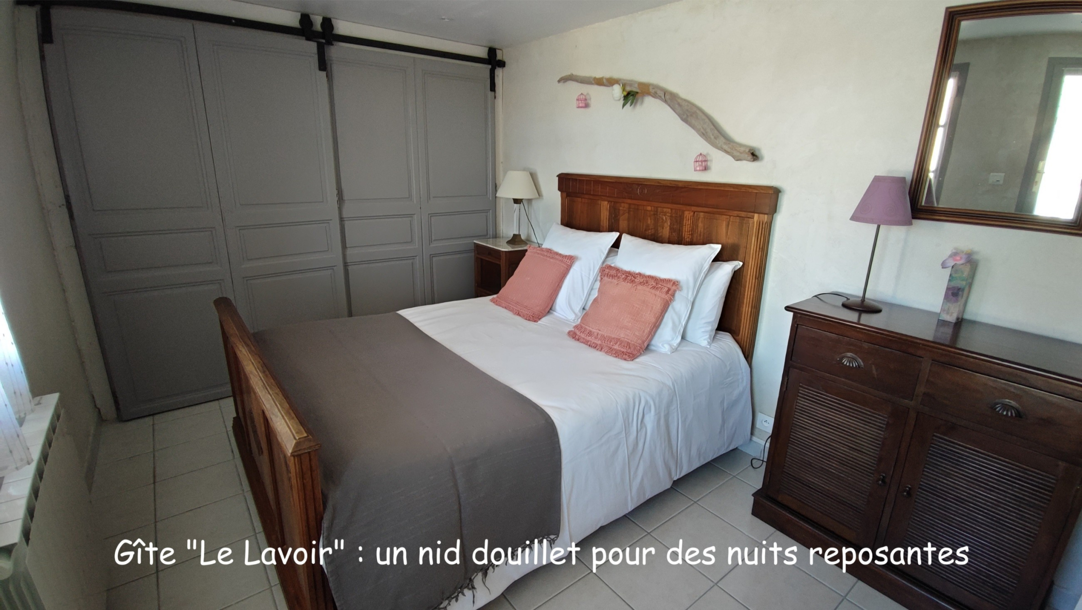 Double bedroom at Le Lavoir holiday cottage with wooden furniture