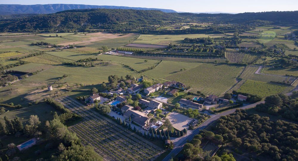 Shaded terrace at Carcarille Hôtel & Spa at the foot of the village of Gordes