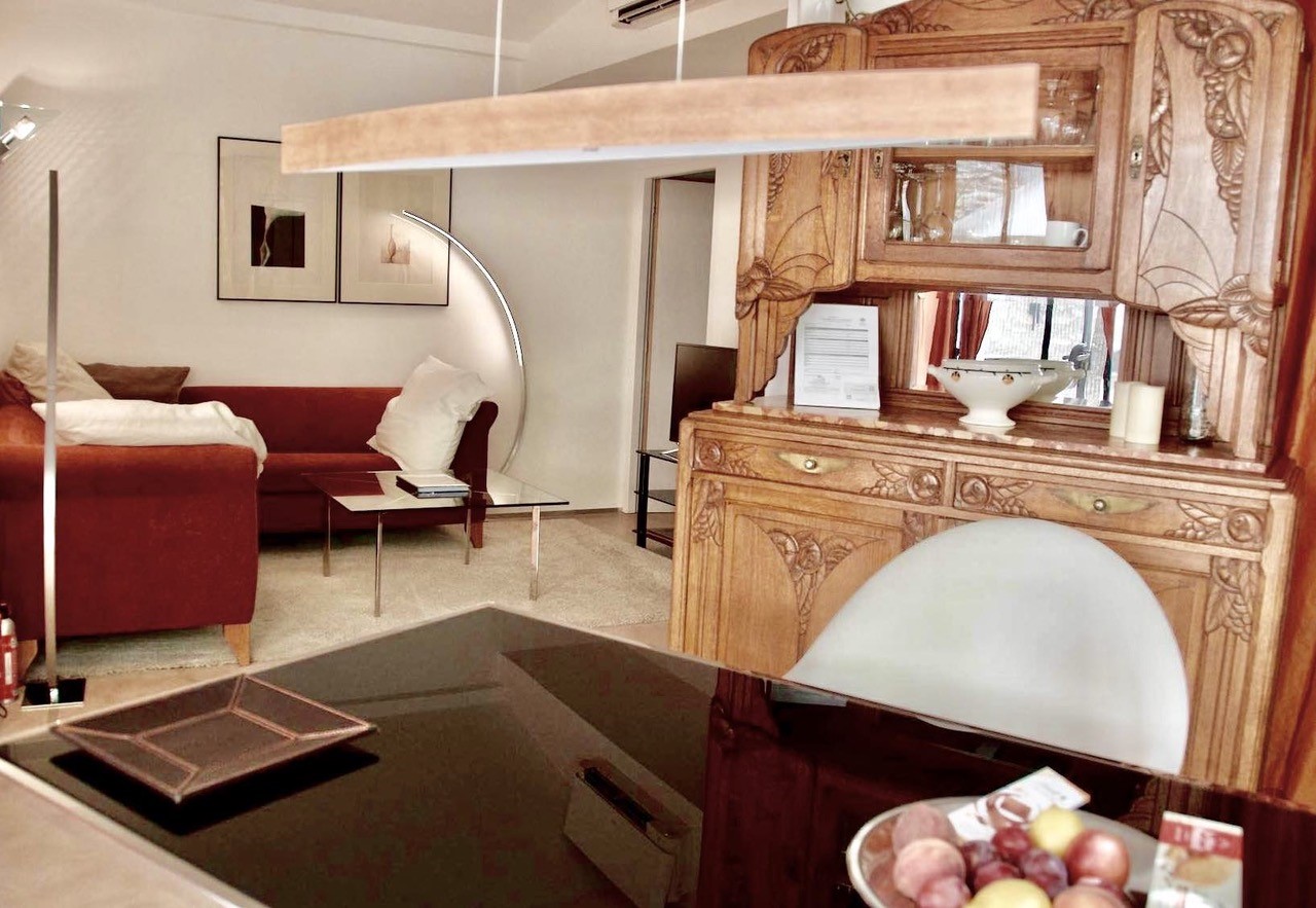 La Suite at Maison Bertuli, designer kitchen open onto the living room