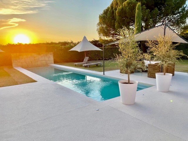 Heated swimming pool at Maison Bertuli at sunset