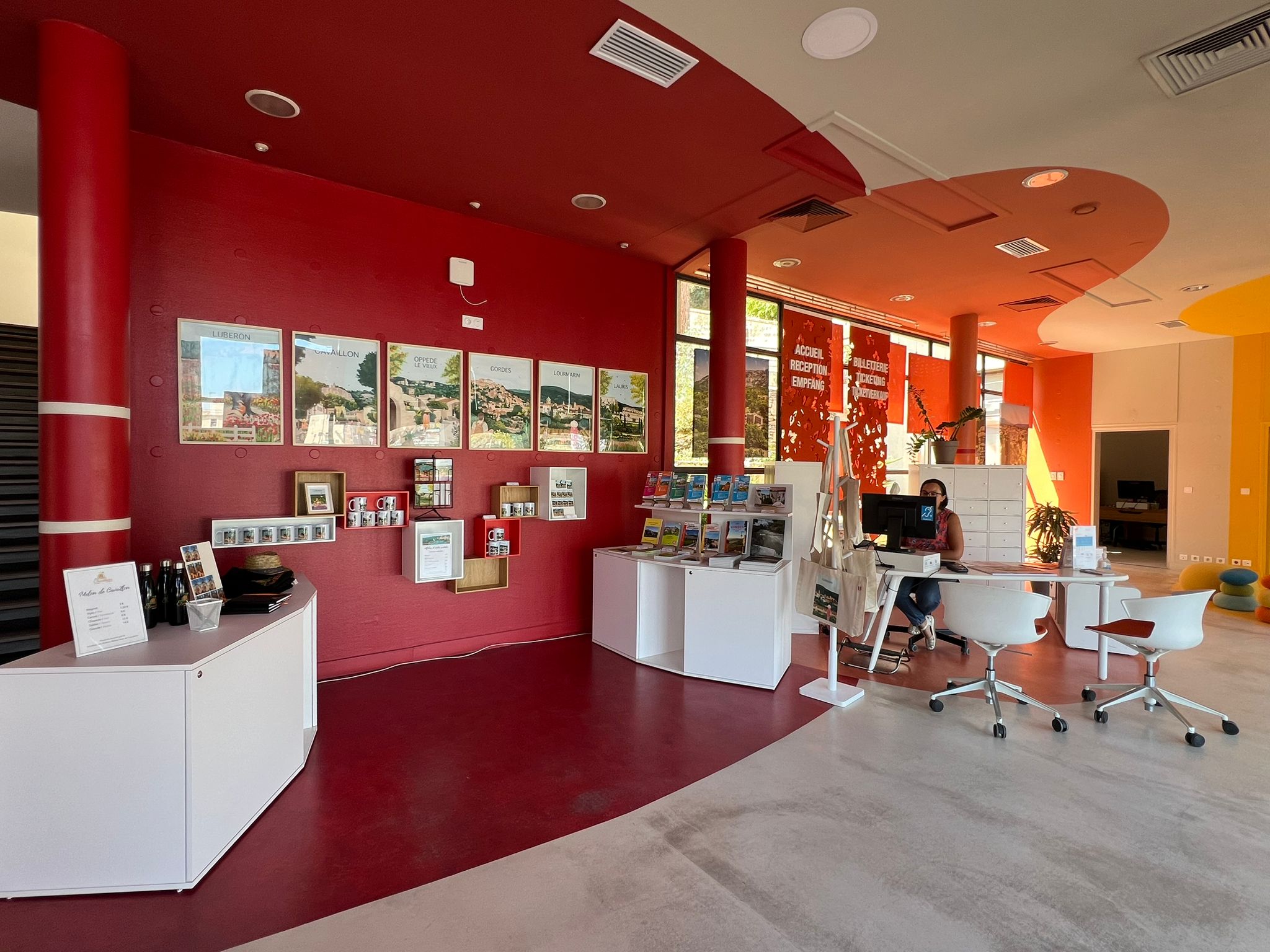 Bright and spacious reception area at the Destination Luberon Tourist Office in Cavaillon, providing information on regional activities.