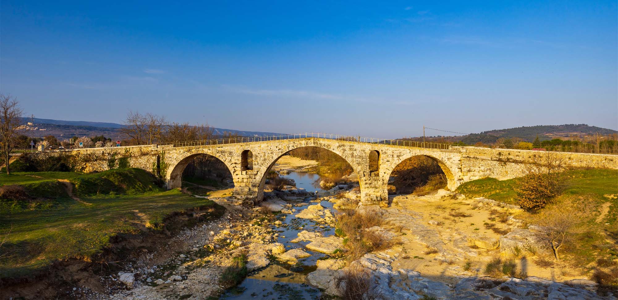 View of Pont Julien, Roman stone bridge in Bonnieux in the Luberon