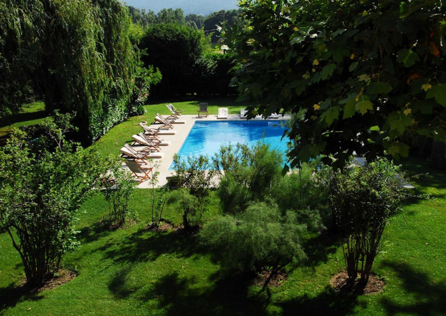 Heated pool at Mas des Grès surrounded by Mediterranean gardens